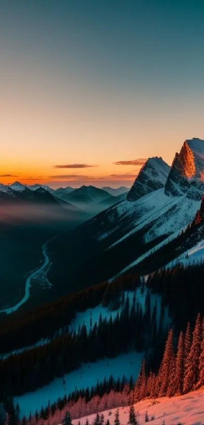 Sunset over snowy mountains with orange glow.