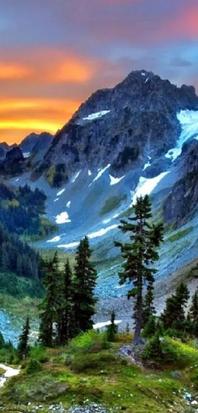 Stunning sunset over mountains with vibrant sky and lush greenery.