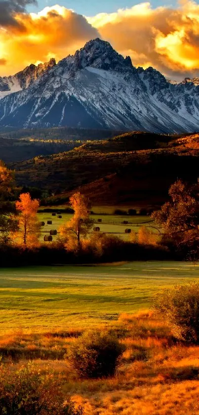 Scenic mobile wallpaper featuring a sunset over mountains and autumn scenery.