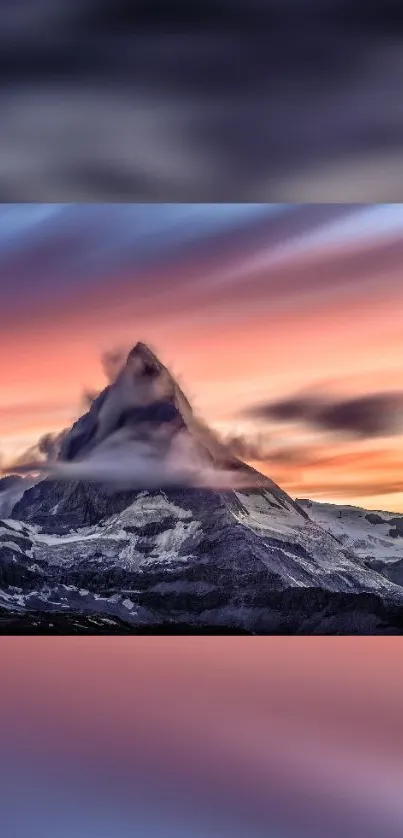 Majestic mountain at sunset with colorful sky.