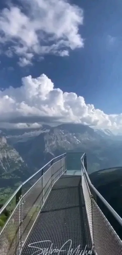 Mountain pathway under a vibrant blue sky with clouds.