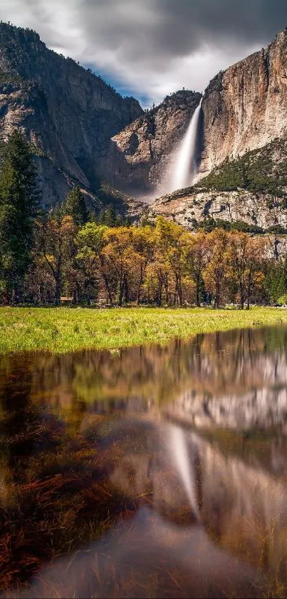 Waterfall cascading down mountain with reflection in calm water.