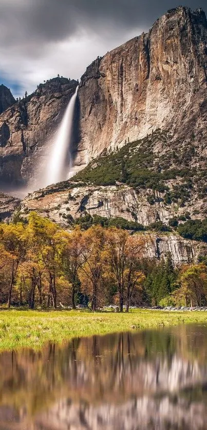 Majestic mountain with cascading waterfall reflecting in serene waters.