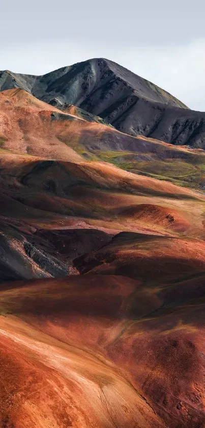 Multicolored mountain landscape with vibrant earthy tones.