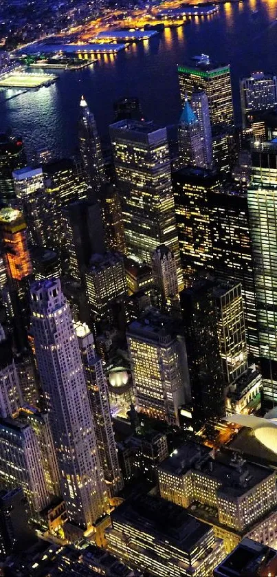 Aerial view of New York City skyline illuminated at night.