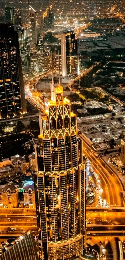 Aerial view of a city skyline at night with glowing gold lights.