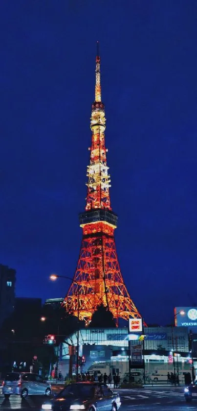 Tower illuminated in city at night with glowing lights.