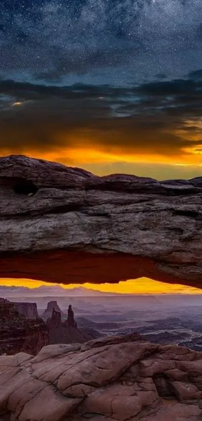 Starry night over a canyon with vibrant sunset and rocky formations.