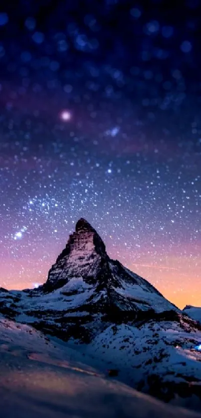 Majestic mountain under starry night sky.