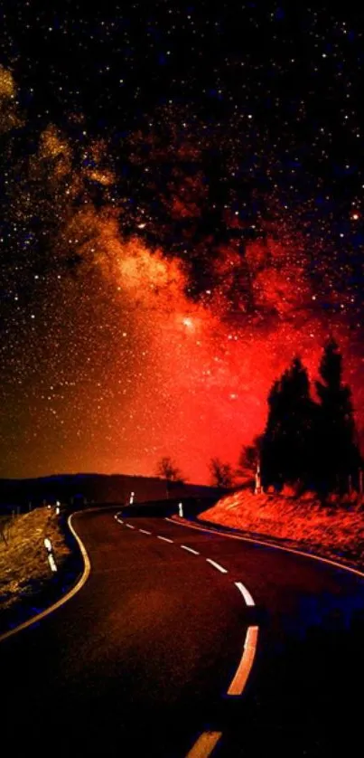 Curved road under a stunning red starry night sky.