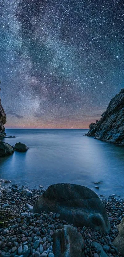 Starry night over calm sea with rocky cliffs and pebble shore.