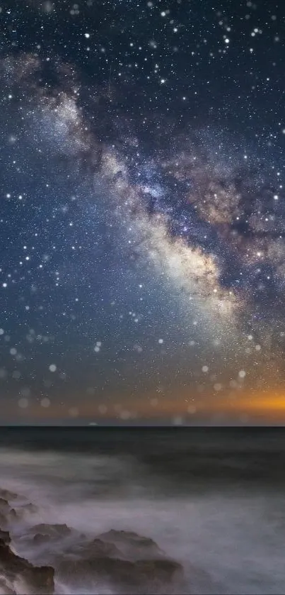 Vibrant night sky with stars and Milky Way over a calm seascape.