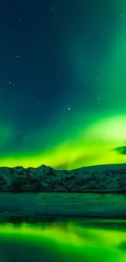 Vibrant northern lights over snowy mountains and serene water reflection at night.