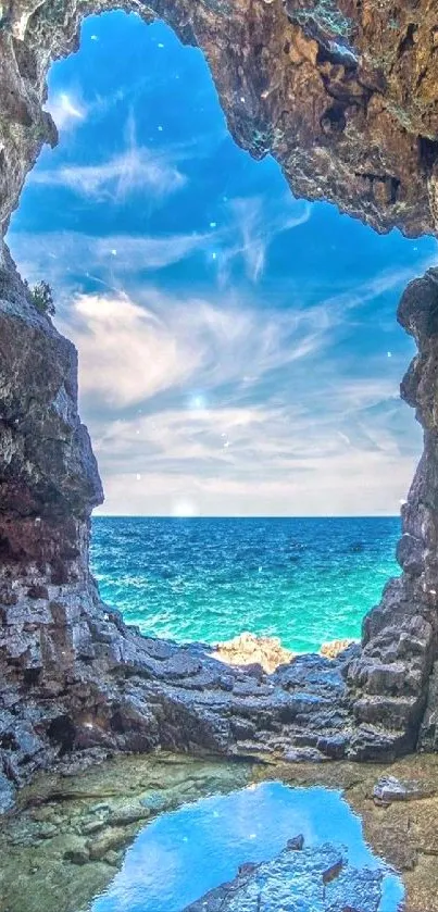 Breathtaking seaside view through rocky cave opening with blue sky and ocean.