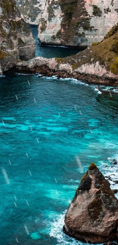 Turquoise ocean with cliffs and sandy beach.