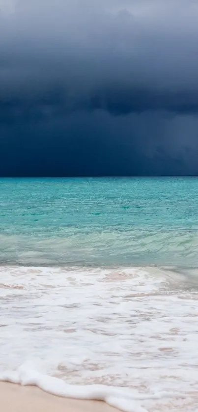 Stormy ocean beach wallpaper with turquoise seas and dark skies.