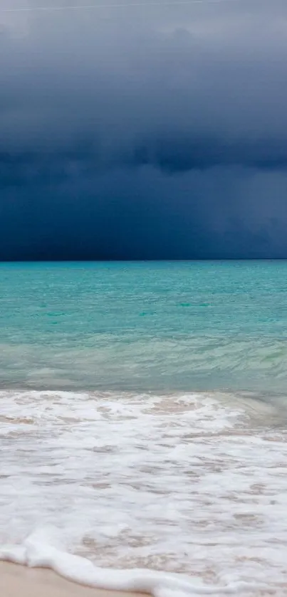 Dramatic ocean storm with a teal sea and dark clouds above a sandy shore.