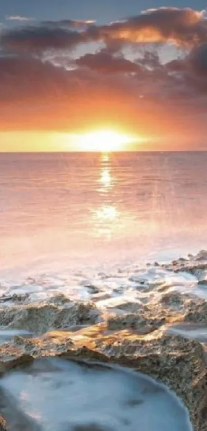 Breathtaking sunrise over a serene ocean with dramatic clouds.