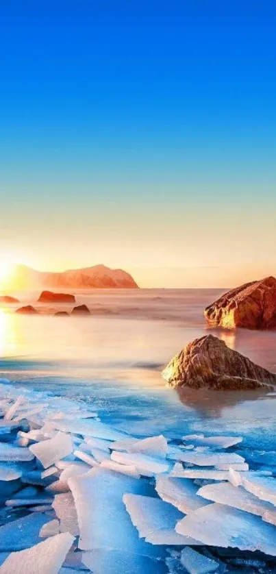 Beautiful ocean sunrise with icy foreground and rocky coastline.