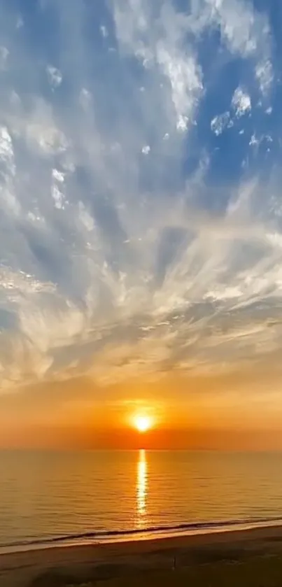 Vibrant ocean sunset with dramatic sky and reflective water.