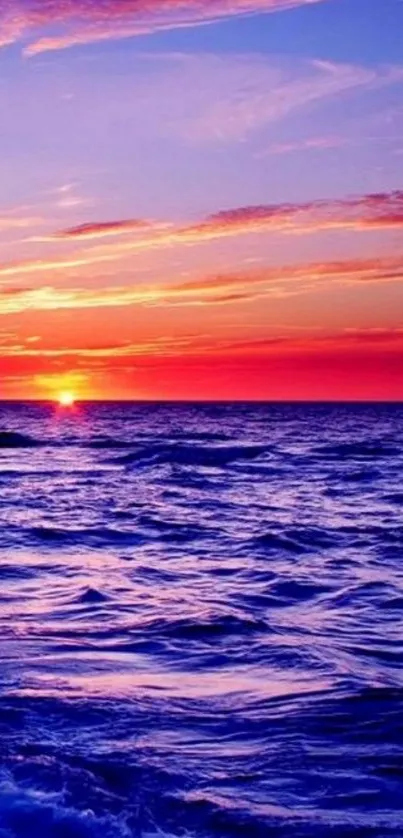 Vibrant ocean sunset wallpaper with colorful sky and serene waves.