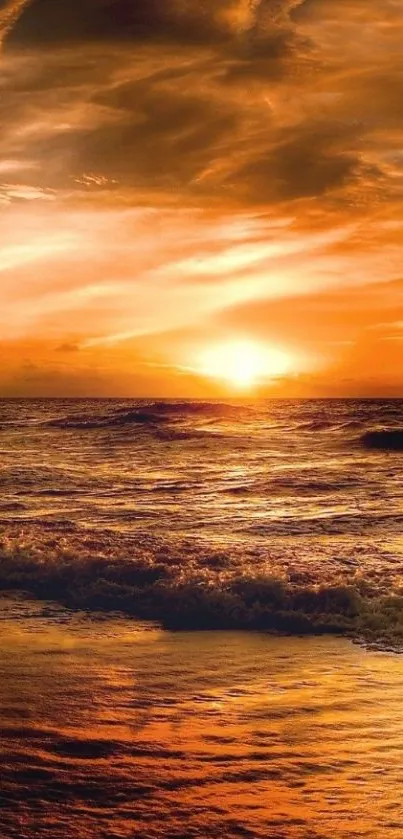 Beautiful sunset over ocean waves with orange and gold hues.