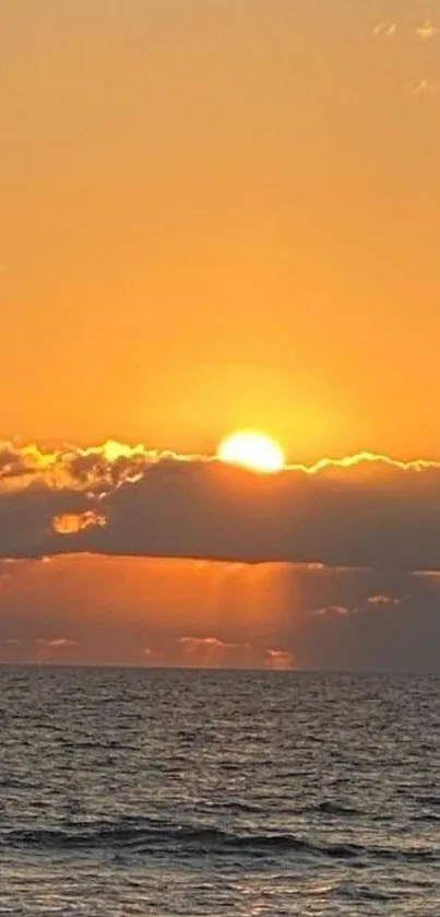 Golden ocean sunset with clouds and sea view.