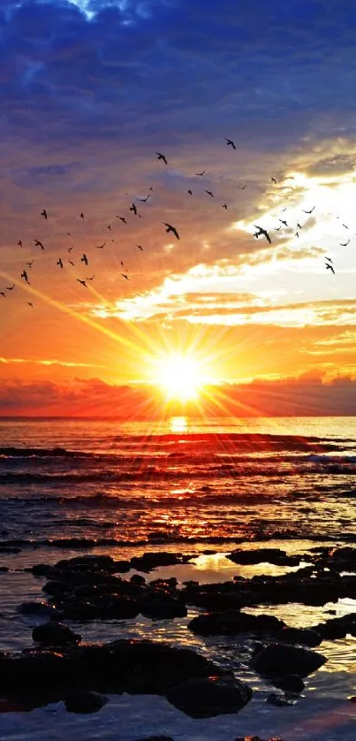 Beautiful sunset over ocean with vibrant orange and blue colors.