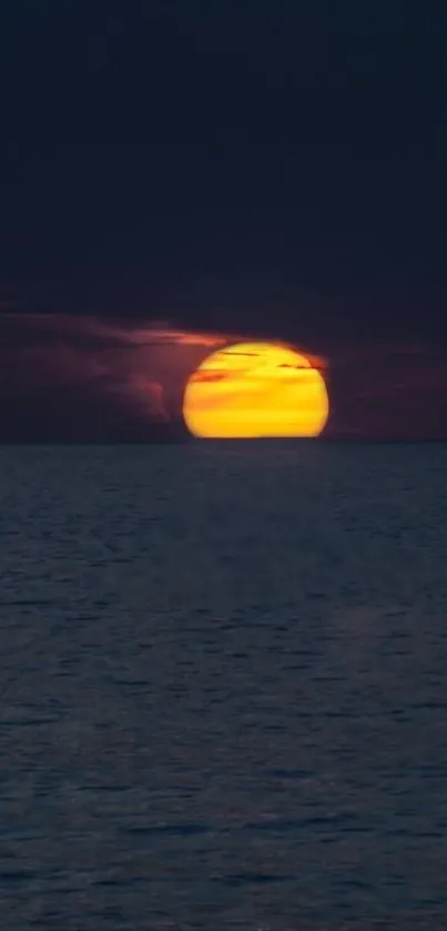 Beautiful sunset over a calm ocean horizon.