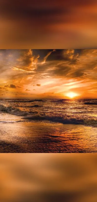 Stunning sunset over ocean waves with orange and gold hues.