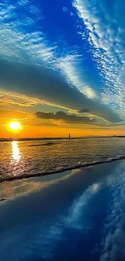 Vibrant ocean sunset with beach reflection and blue sky.