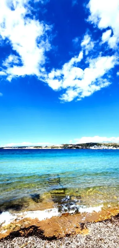 Beautiful ocean view with blue sky and sandy beach.