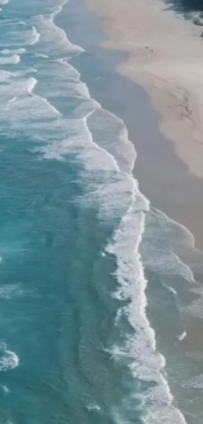 Beautiful ocean wallpaper with waves crashing on a sandy beach.