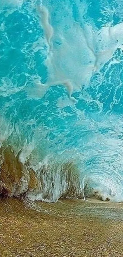 Vibrant turquoise ocean wave crashing on sandy beach.