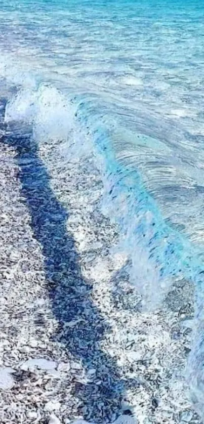 Beautiful ocean waves crashing on a white sandy beach, under a clear blue sky.