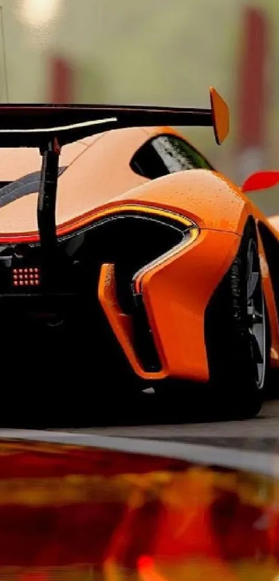 Orange sports car with sleek design and reflection on the wet road.