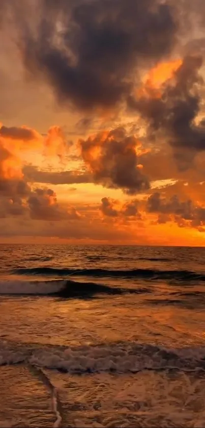 Orange sunset over ocean with clouds and waves.