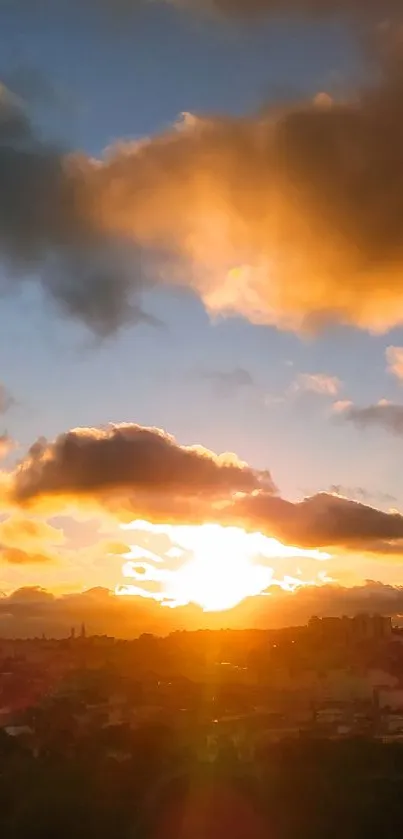 Beautiful orange sunset sky with dramatic clouds over landscape.