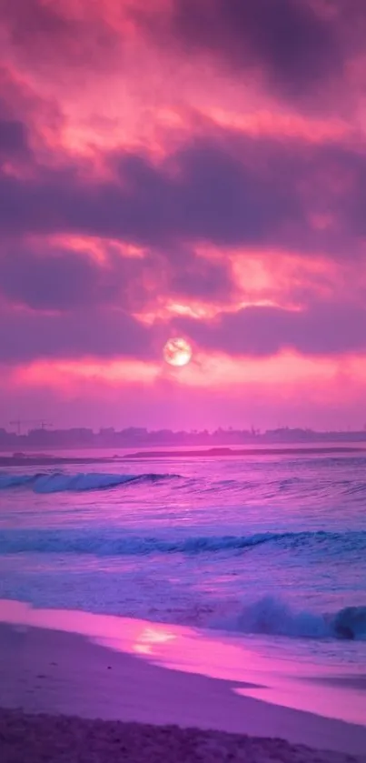 Pink sunset over ocean with waves