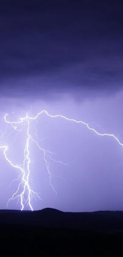 Purple lightning illuminating a dark night sky.