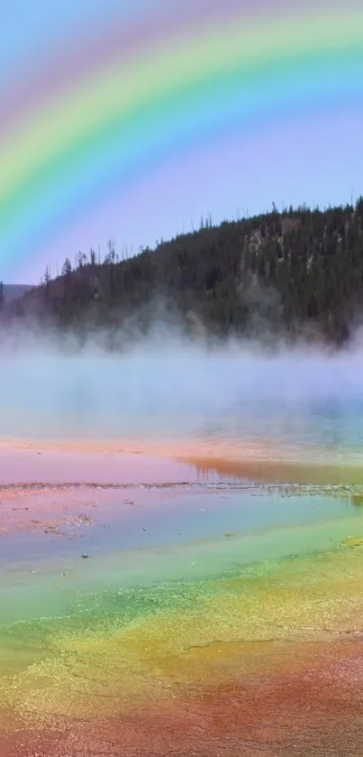 Vibrant rainbow arching over a serene lake landscape with mist.