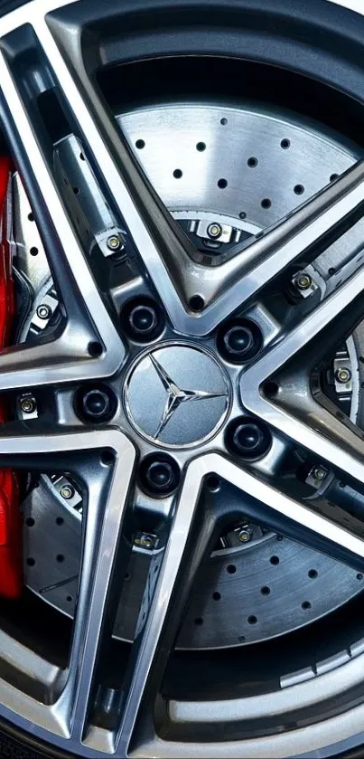 Close-up of car rim with red brake caliper design.