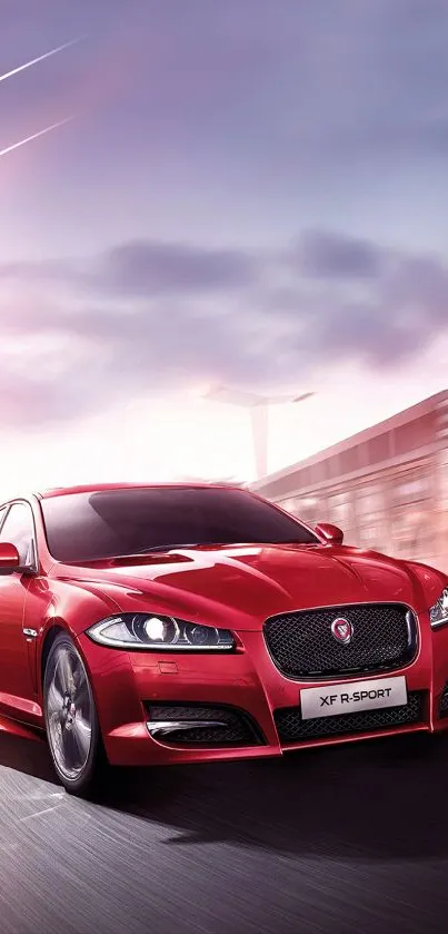 Vibrant red sports car speeding on road with blurred city backdrop.