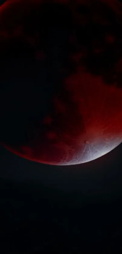 A stunning red moon floats in a dark, mystical sky, creating an enigmatic atmosphere.