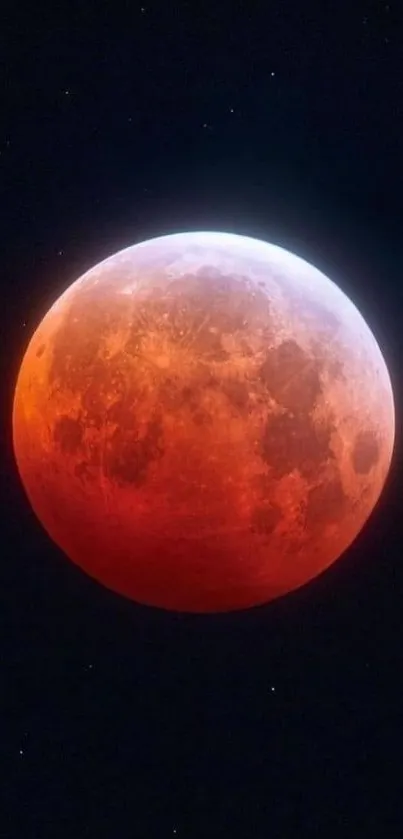 A red moon against a starry black sky, showcasing lunar details.