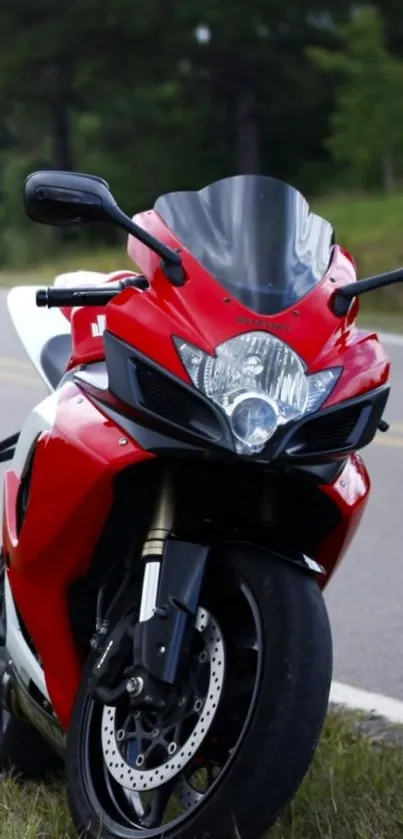 Bold red motorcycle on a scenic road.