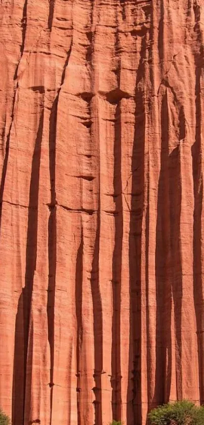 Majestic red rock cliff in desert landscape.