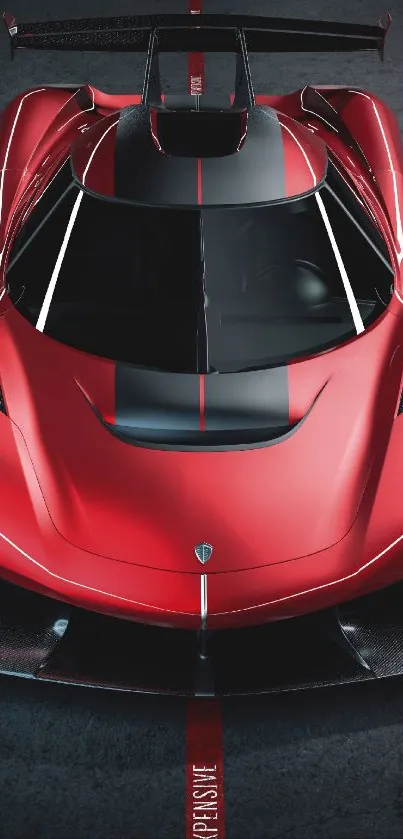 Top view of a sleek red sports car on a dark road background.