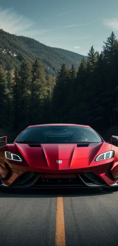 Sleek red sports car on scenic road surrounded by trees.