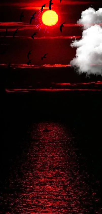 Red sunset with birds over a dark ocean.